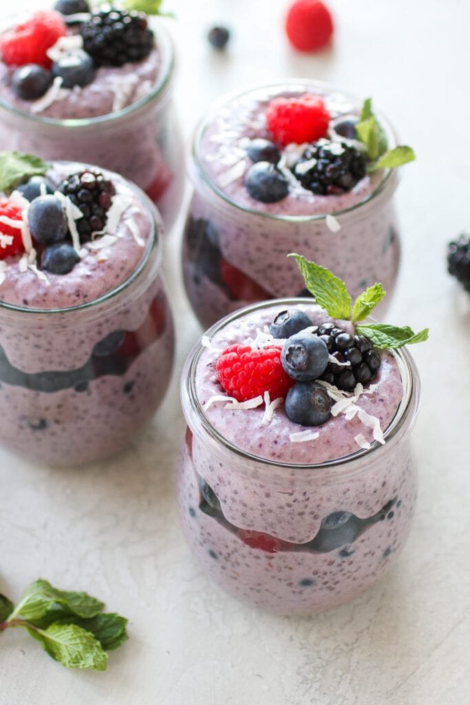 High fiber chia pudding with raspberries, blueberries, and dried coconut